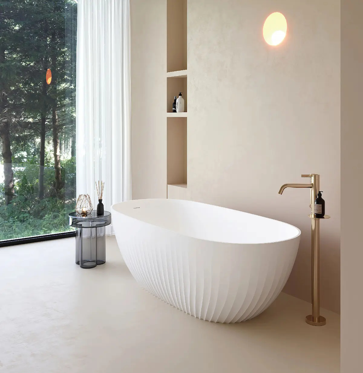 White bathtub in a bright bathroom interior